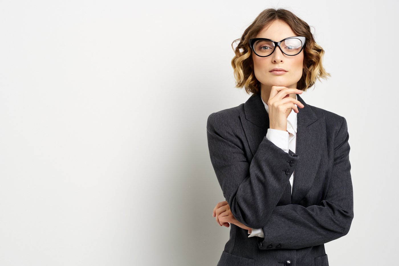 Confident Business Woman in Suit Gesturing with Hands Work Light Background