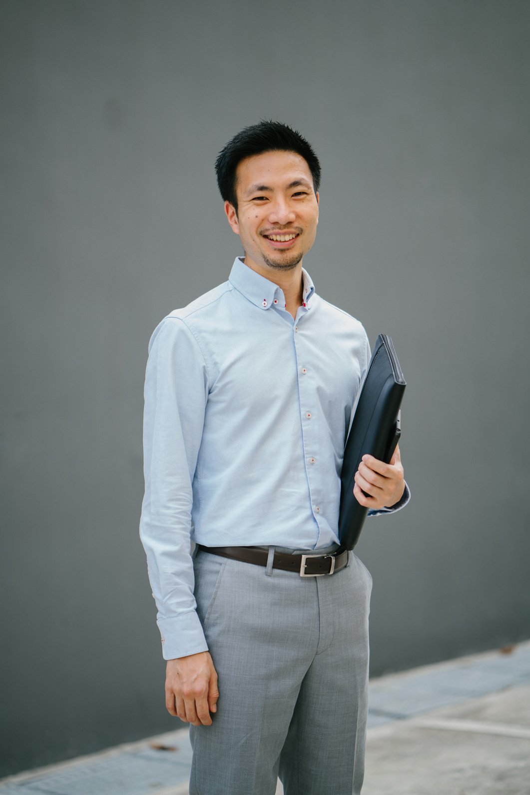 Man Holding Black Laptop Bag